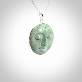 Hand made New Zealand Jade moon face necklace with Sterling Silver. Made by NZ Pacific and sale online only. Delivered with sterling silver chain and packaged in a woven kete pouch.